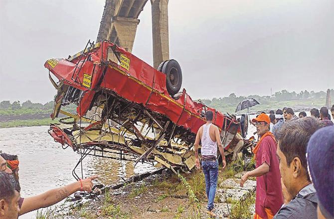 The ST bus was pulled out of the river with the help of a crane. (PTI)